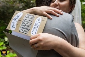 Home in Atlanta is the setting for an intimate moment as the bride and groom exchange heartfelt personal cards just before their wedding ceremony begins.